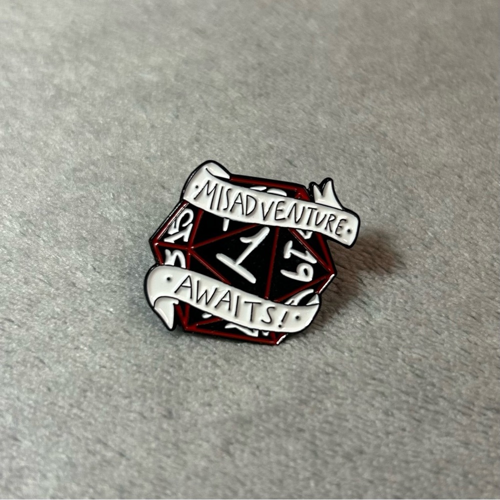 “Misadventure Awaits” D20 Enamel Pin